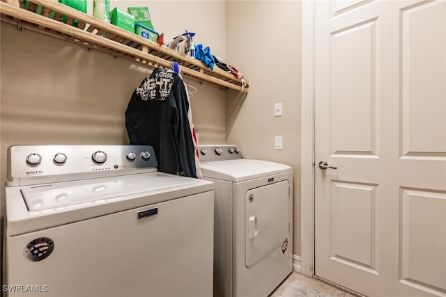 washroom with independent washer and dryer