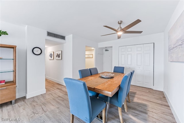 dining space featuring light hardwood / wood-style flooring and ceiling fan