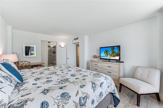 bedroom featuring light wood-type flooring