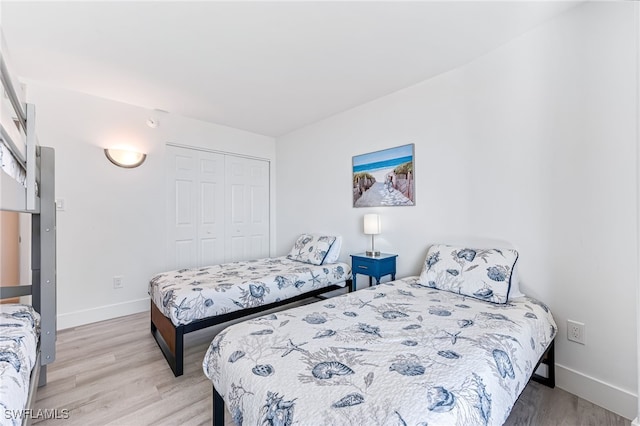 bedroom with a closet and light wood-type flooring