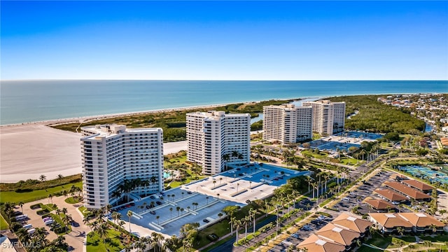 drone / aerial view with a water view and a view of the beach