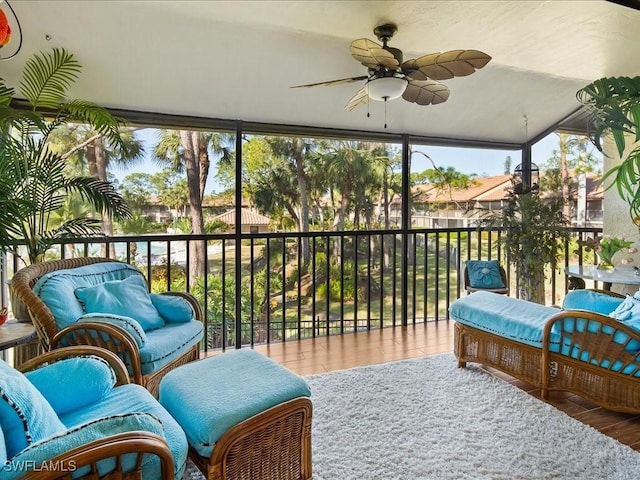 sunroom featuring ceiling fan