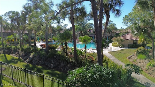 exterior space with a yard and a pool