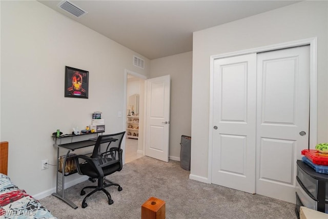 carpeted bedroom with a closet