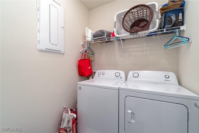 laundry area featuring washing machine and dryer and electric panel