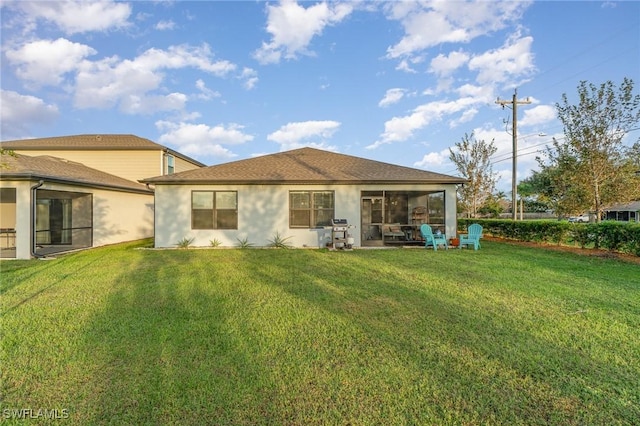 back of house featuring a yard