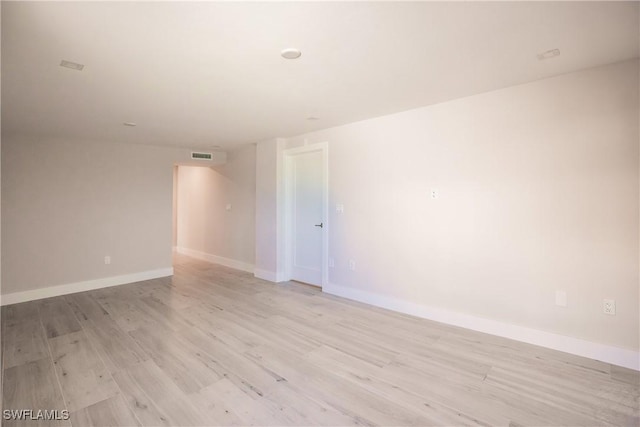 empty room with light hardwood / wood-style floors