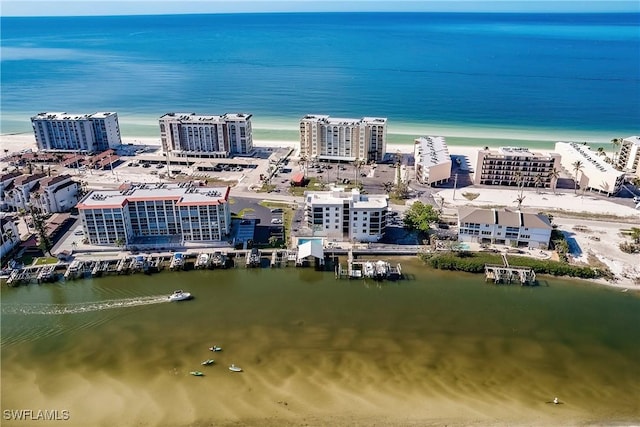 birds eye view of property featuring a water view and a view of the beach