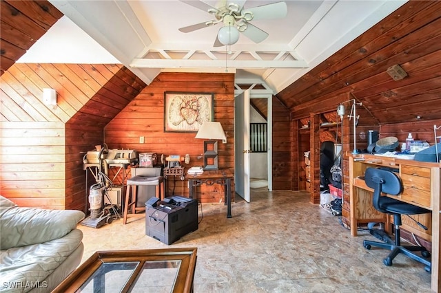 office featuring lofted ceiling, ceiling fan, and wooden walls