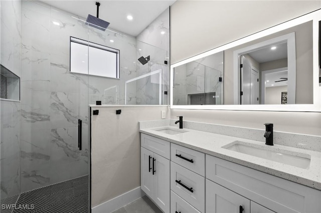 bathroom with vanity and a shower with shower door