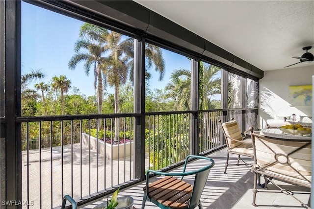 7225 Pelican Bay Blvd Unit 203, Naples, FL 34108 - sunroom with ceiling fan