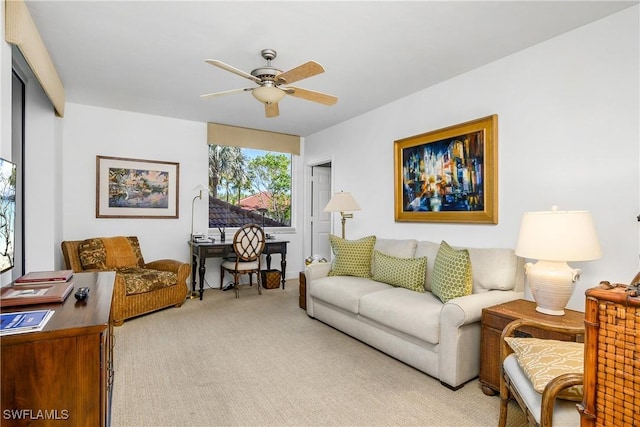 carpeted living room featuring ceiling fan