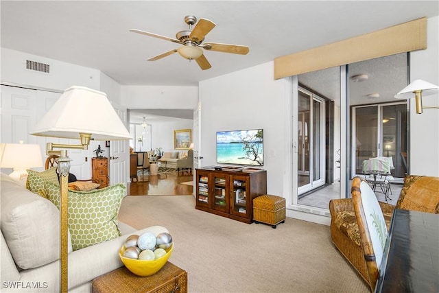 7225 Pelican Bay Blvd Unit 203, Naples, FL 34108 - living area with a ceiling fan and carpet