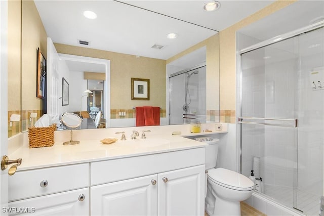 7225 Pelican Bay Blvd Unit 203, Naples, FL 34108 - full bathroom featuring a stall shower, toilet, vanity, and recessed lighting