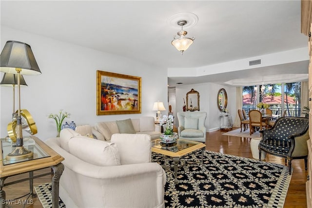 living room with dark hardwood / wood-style floors