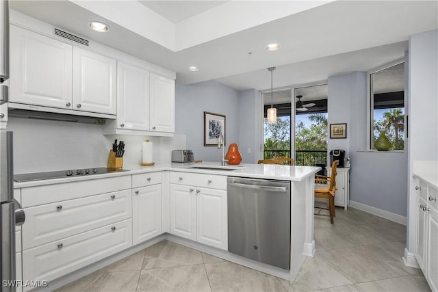 7225 Pelican Bay Blvd Unit 203, Naples, FL 34108 - kitchen with stainless steel dishwasher, a sink, under cabinet range hood, light countertops, and white cabinets