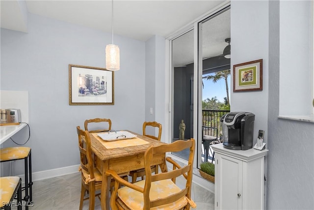 7225 Pelican Bay Blvd Unit 203, Naples, FL 34108 - dining area featuring baseboards