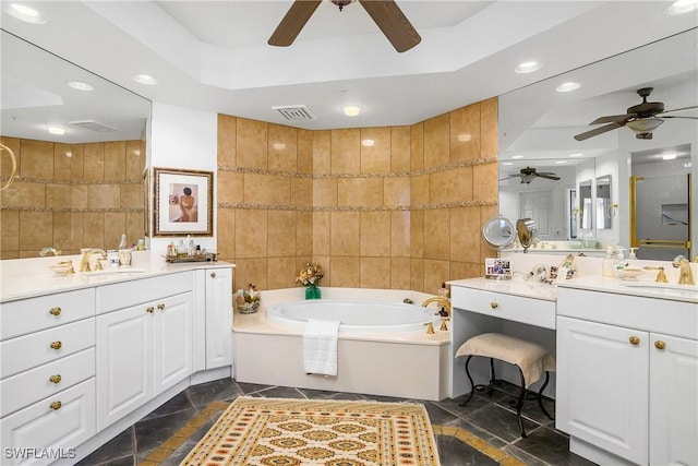 bathroom with vanity, tile walls, and shower with separate bathtub