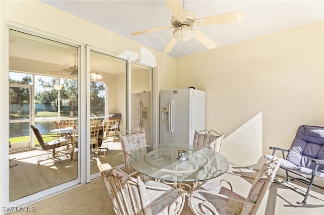 11021 Gulf Reflections Dr Unit 103, Fort Myers, FL 33908 - interior space with a water view, ceiling fan, and outdoor dining area