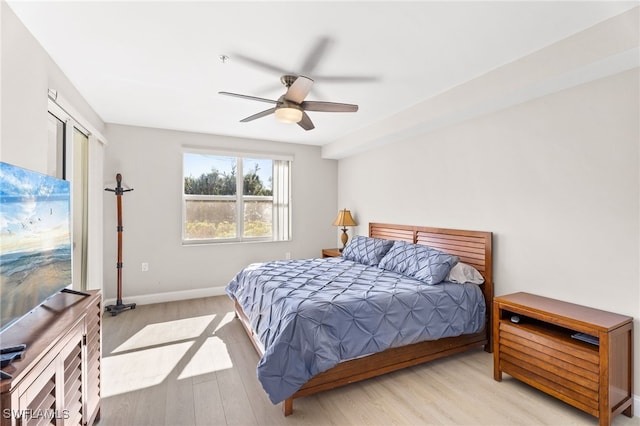 11021 Gulf Reflections Dr Unit 103, Fort Myers, FL 33908 - bedroom with baseboards, a ceiling fan, and wood finished floors