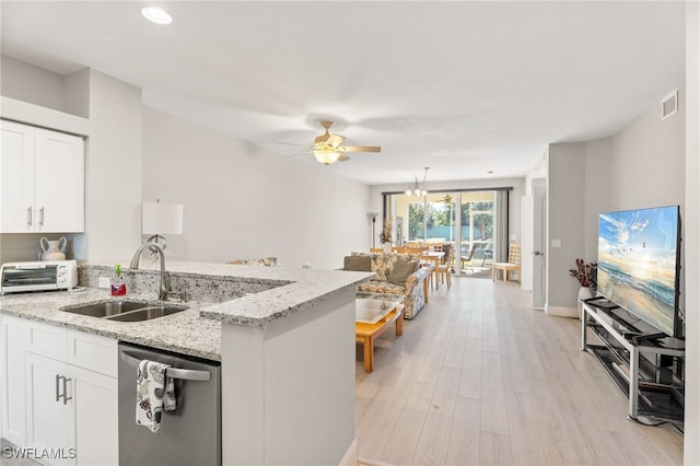 kitchen with white cabinetry, dishwasher, light stone countertops, sink, and light hardwood / wood-style floors