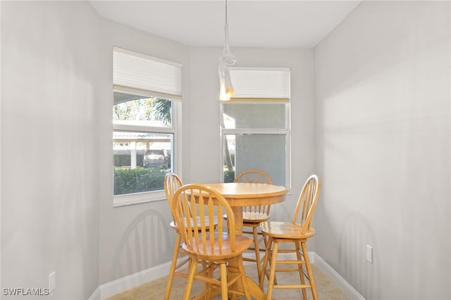 dining area featuring light tile patterned floors