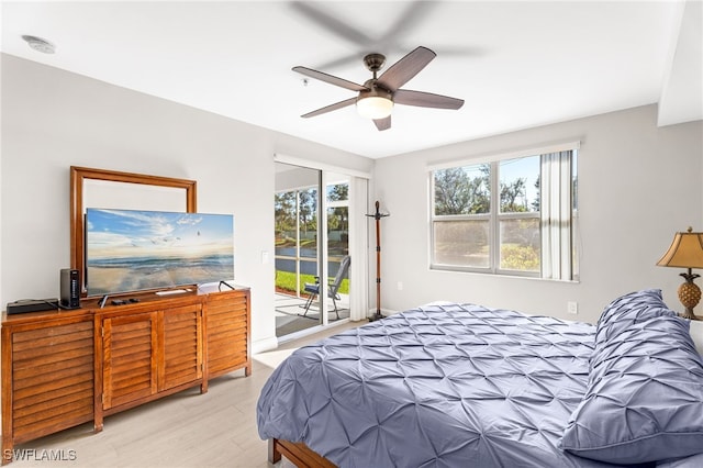 bedroom with ceiling fan, access to exterior, and light wood-type flooring