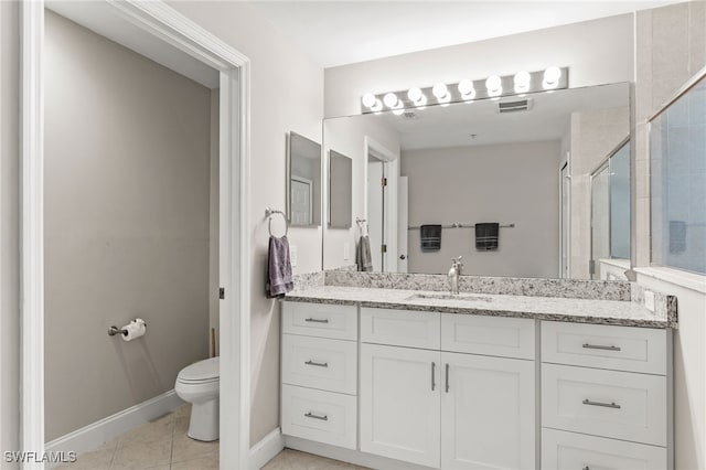 11021 Gulf Reflections Dr Unit 103, Fort Myers, FL 33908 - full bath with baseboards, toilet, vanity, tile patterned flooring, and a stall shower