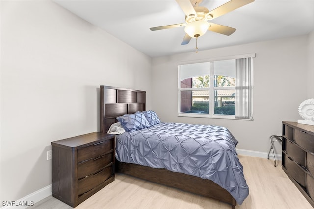 bedroom featuring light hardwood / wood-style floors and ceiling fan