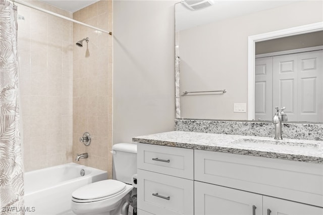 11021 Gulf Reflections Dr Unit 103, Fort Myers, FL 33908 - full bathroom featuring toilet, visible vents, vanity, and shower / tub combo with curtain