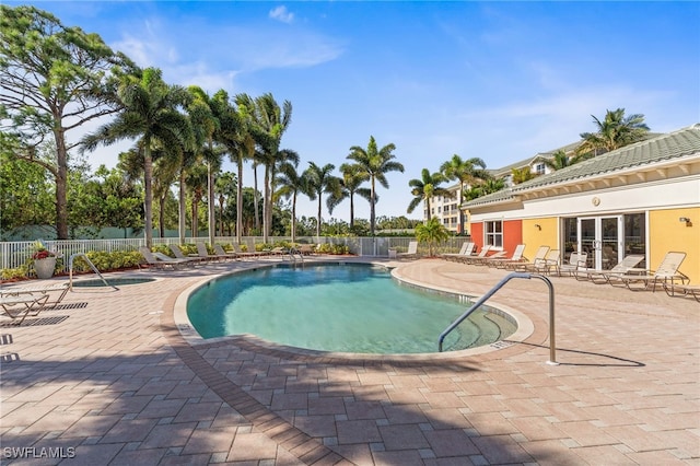 11021 Gulf Reflections Dr Unit 103, Fort Myers, FL 33908 - community pool featuring a patio and fence