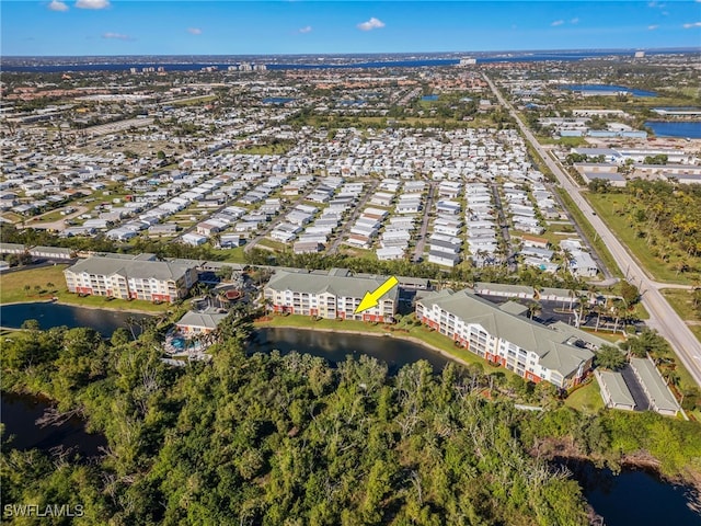 11021 Gulf Reflections Dr Unit 103, Fort Myers, FL 33908 - aerial view with a water view and a residential view