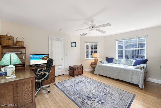 bedroom with ceiling fan and light wood-type flooring