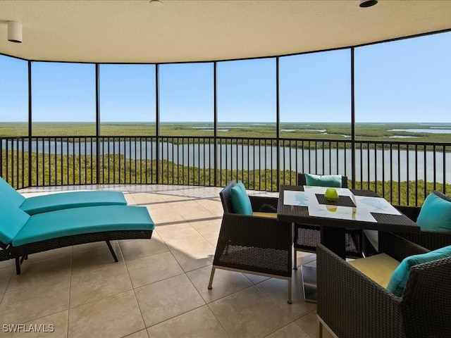 sunroom with a water view