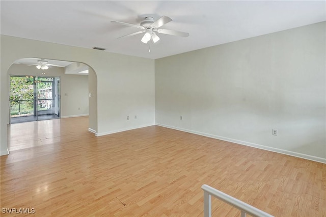 spare room with ceiling fan and light hardwood / wood-style floors