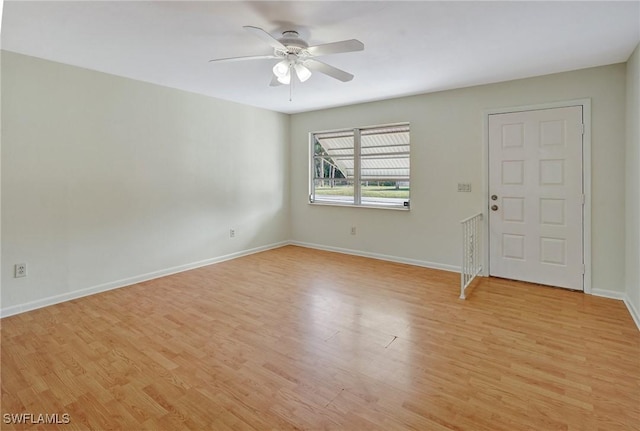 spare room featuring ceiling fan and light hardwood / wood-style flooring