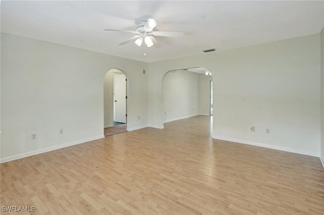 unfurnished room with light hardwood / wood-style flooring and ceiling fan