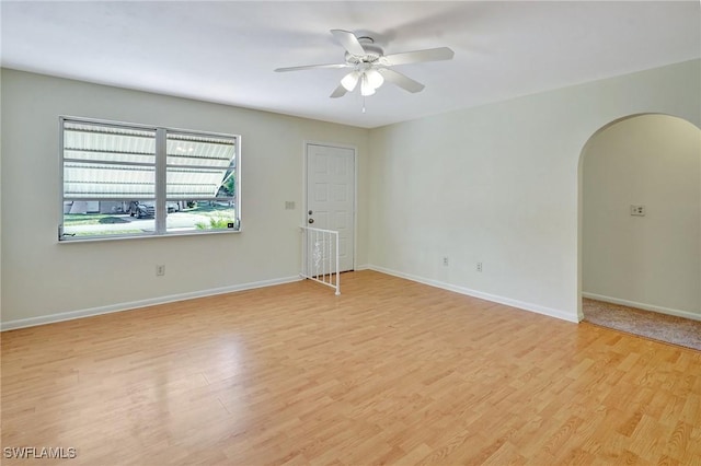 unfurnished room featuring ceiling fan and light hardwood / wood-style floors