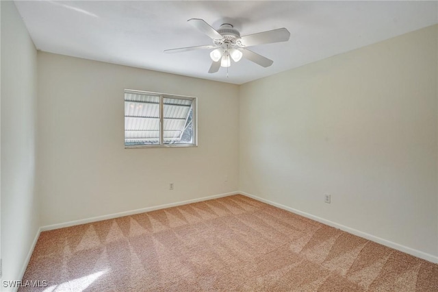 carpeted empty room with ceiling fan