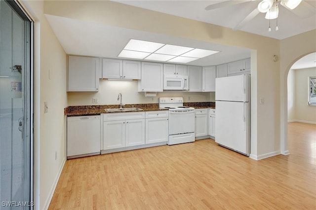 kitchen featuring ceiling fan, sink, white appliances, white cabinets, and light wood-type flooring