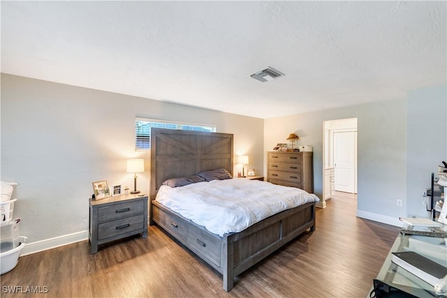 bedroom featuring dark wood-type flooring