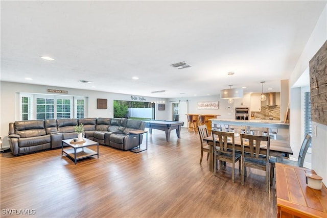 living room featuring light hardwood / wood-style flooring and billiards