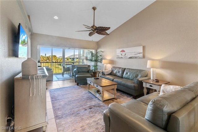 tiled living room with high vaulted ceiling and ceiling fan