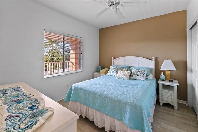 bedroom featuring ceiling fan and light wood-type flooring