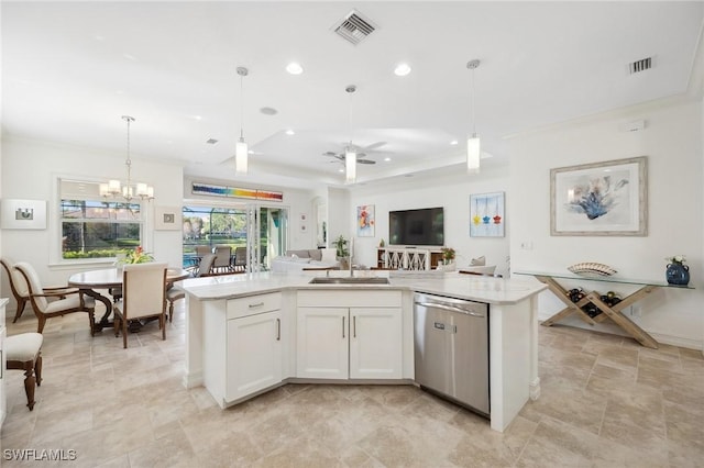 kitchen with pendant lighting, white cabinets, ceiling fan with notable chandelier, a center island with sink, and stainless steel dishwasher