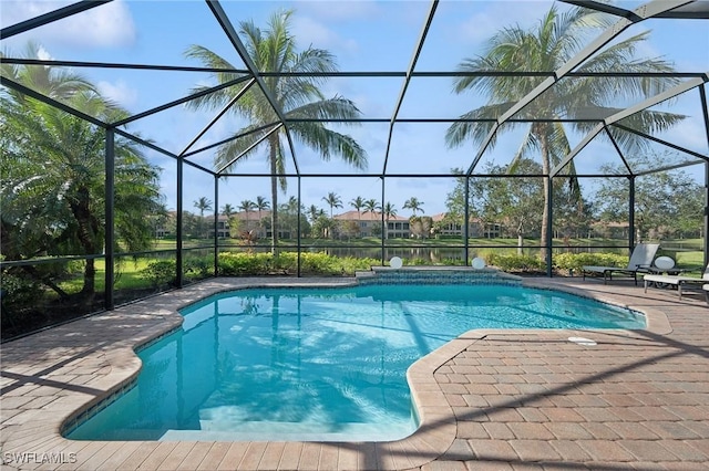 view of pool with a lanai and a patio