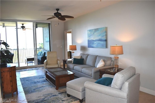 tiled living room with ceiling fan