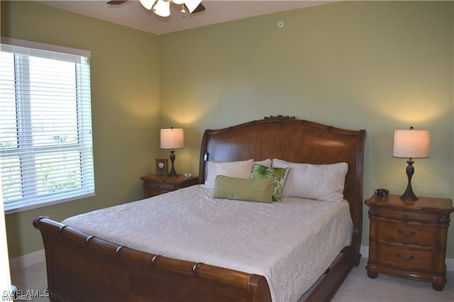 bedroom featuring ceiling fan and light carpet