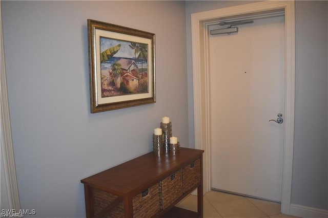 doorway to outside featuring light tile patterned floors