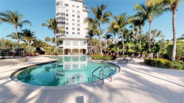 view of swimming pool with a patio area